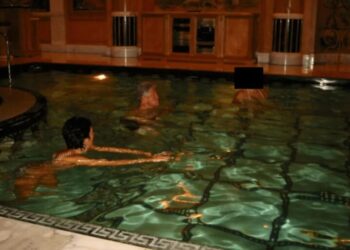 Among sea of redactions, photos of Bill Clinton emerge with Jeffrey Epstein, in a pool with Ghislaine Maxwell