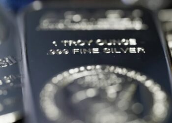 Silver rises to record above $80 in historic end-of-year rally