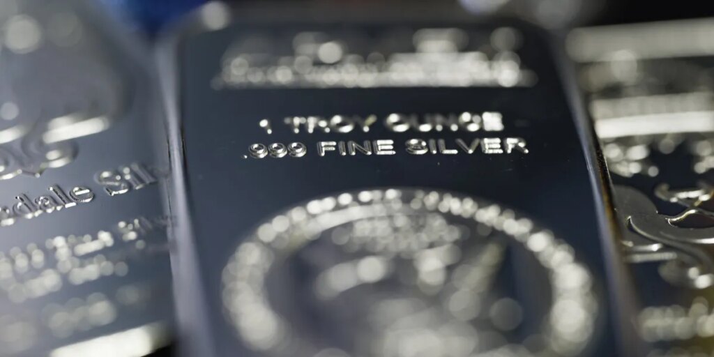 Silver rises to record above $80 in historic end-of-year rally