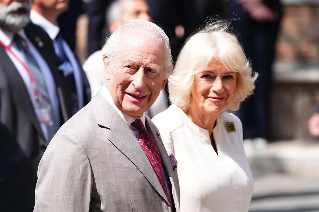 King Charles III and Queen Camilla smiling.