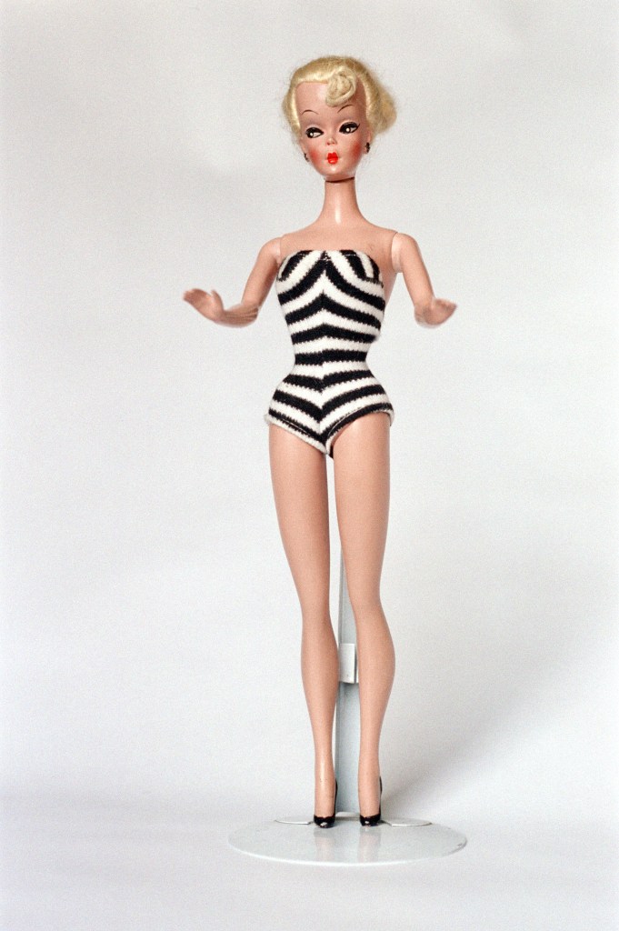 Barbie doll from 1959 in a black and white striped swimsuit.