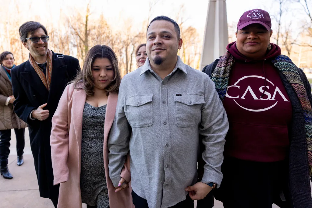 Kilmar Abrego Garcia, his wife Jennifer Vasquez Sura, and attorney Simon Sandoval-Moshenberg arrive at the federal courthouse for an ICE restraining order hearing.