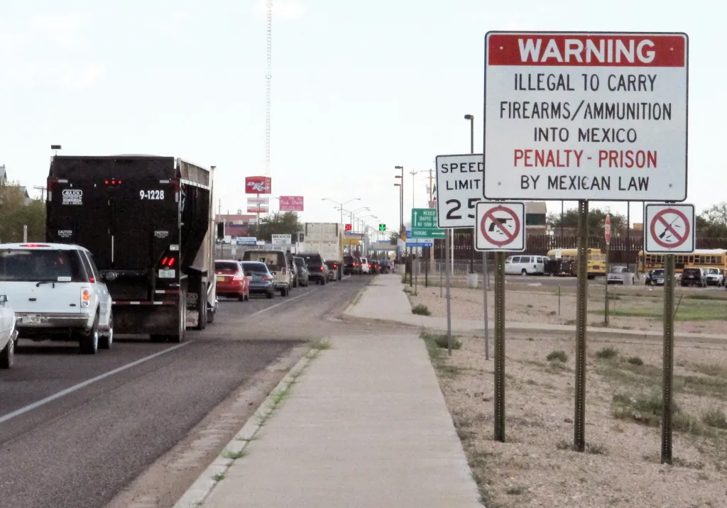 A photo shows signs at the Columbus, N.M., border crossing into Palomas, Mexico, warning travelers against smuggling firearms.
