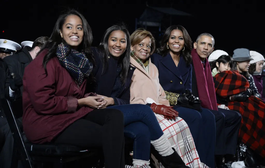 Malia Obama, Sasha Obama, Marian Robinson, Michelle Obama, and Barack Obama attend the national Christmas tree lighting ceremony.