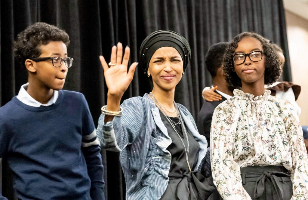Ilhan Omar celebrating her Congressional 5th District primary victory with her son Adnan and daughter Isra.