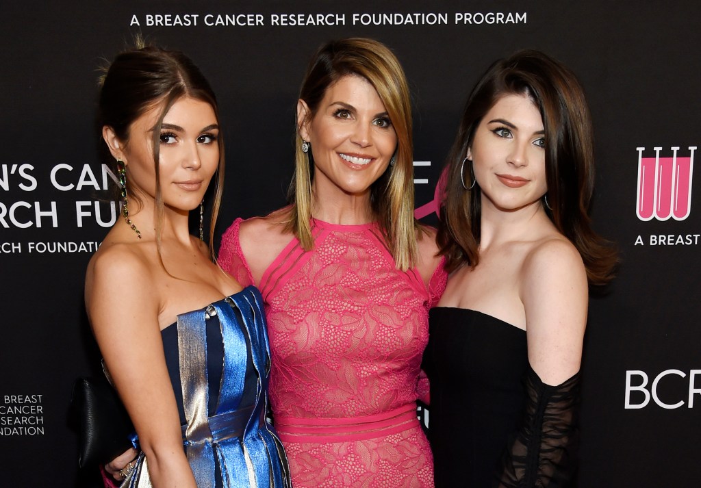 Lori Loughlin, center, poses with daughters Olivia Jade Giannulli, left, and Isabella Rose Giannulli at the 2019