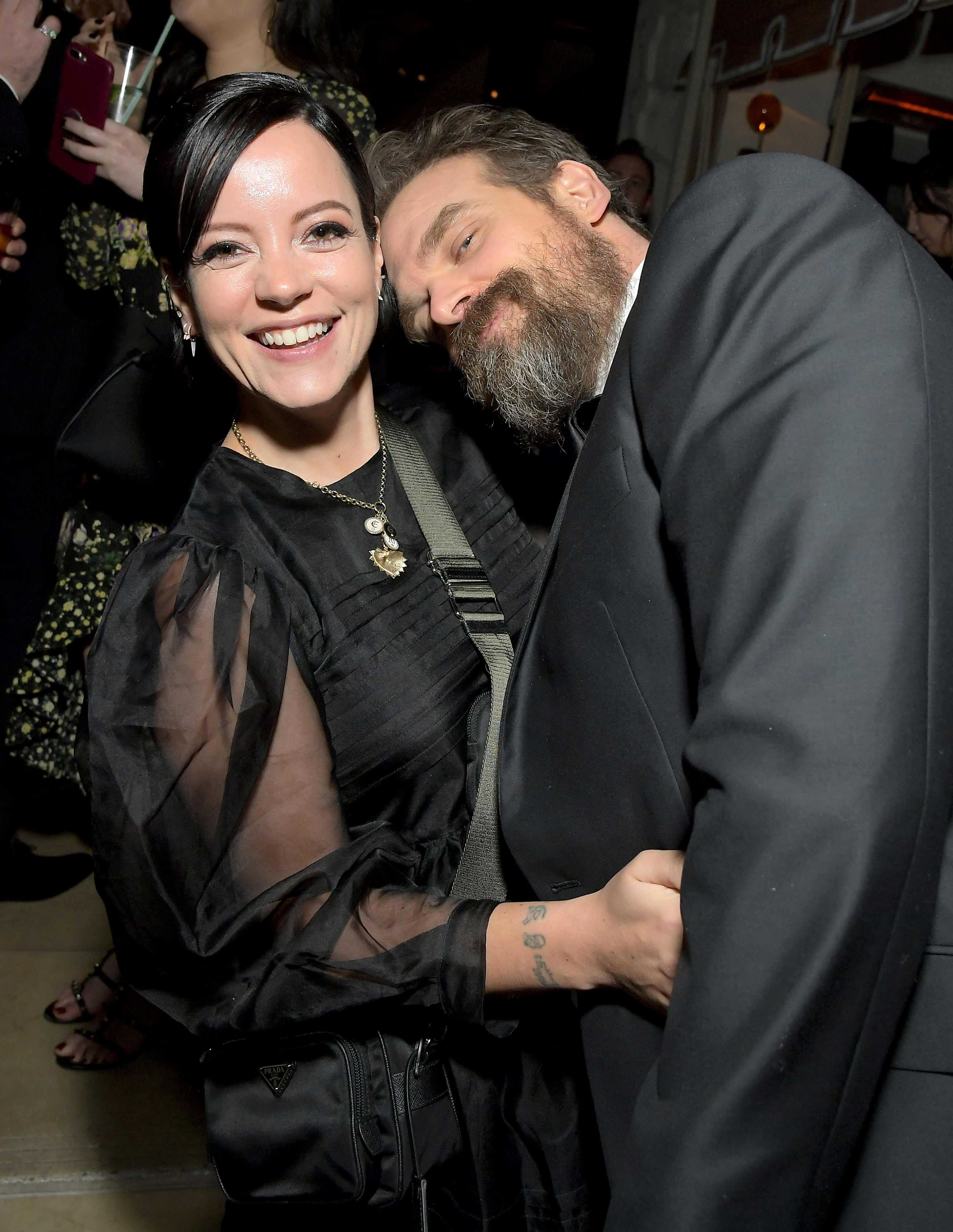 Lily Allen and David Harbour smiling and embracing at the 2020 Netflix SAG After Party.