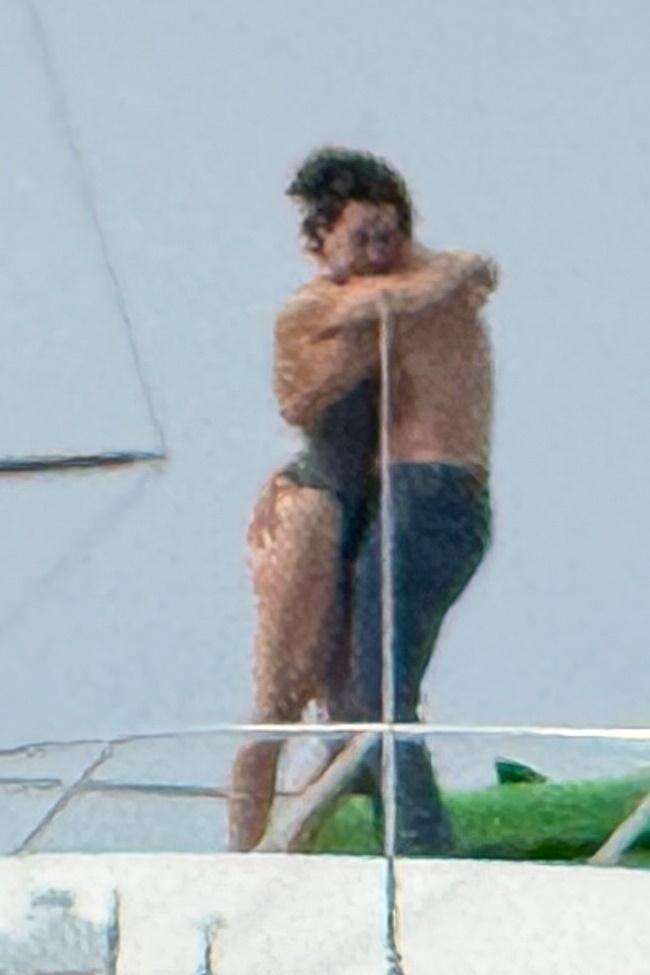 Katy Perry and Justin Trudeau embracing on a yacht.