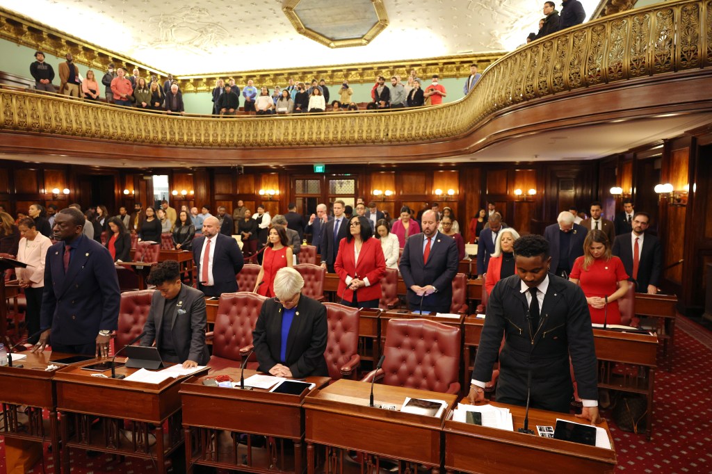 City Council members stand for a prayer during a City Council meeting at City Hall on November 13, 2024 in New York City.