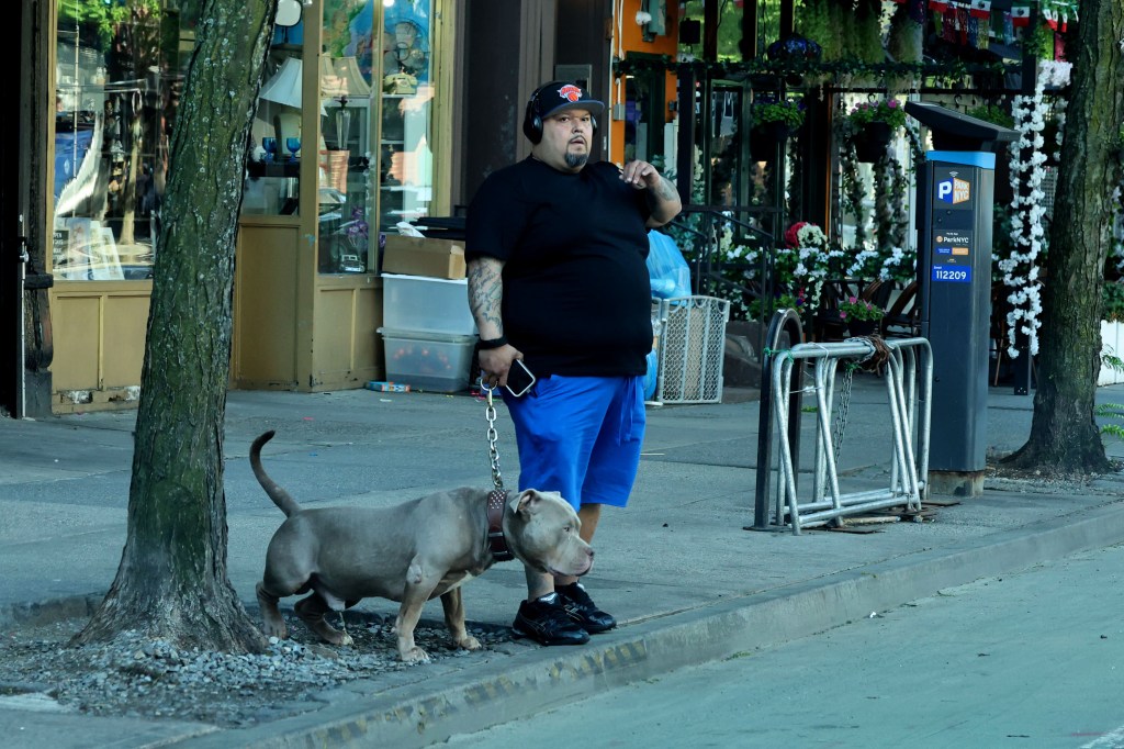 Joe columbus with one of his dogs on a leash