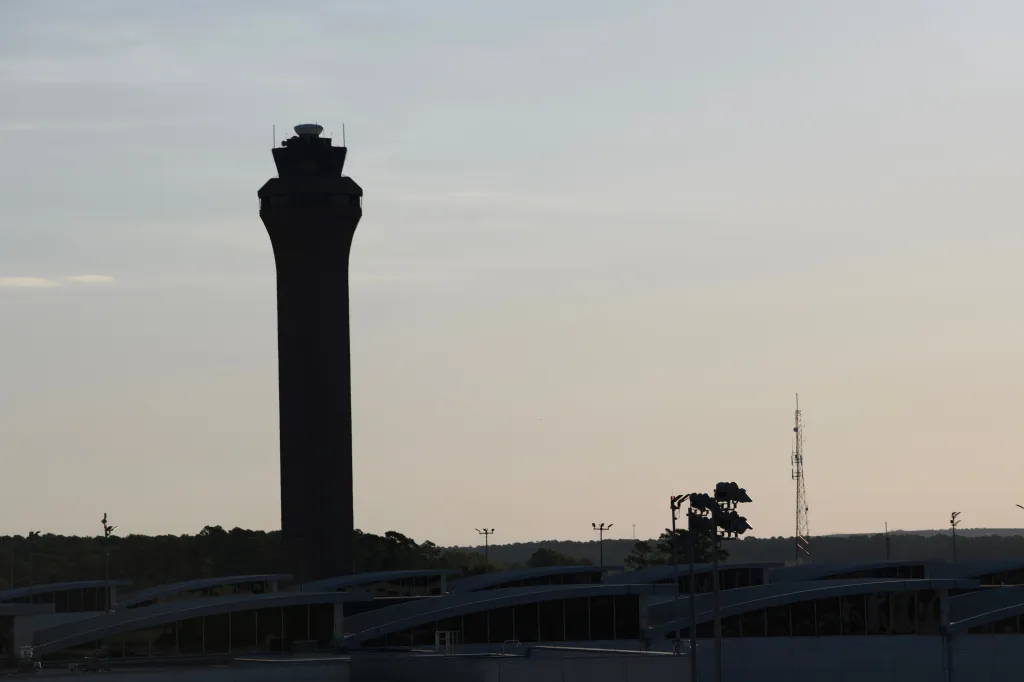 Silhouette of the Federal Aviation Administration (FAA) air traffic control tower at George Bush Intercontinental Airport (IAH).