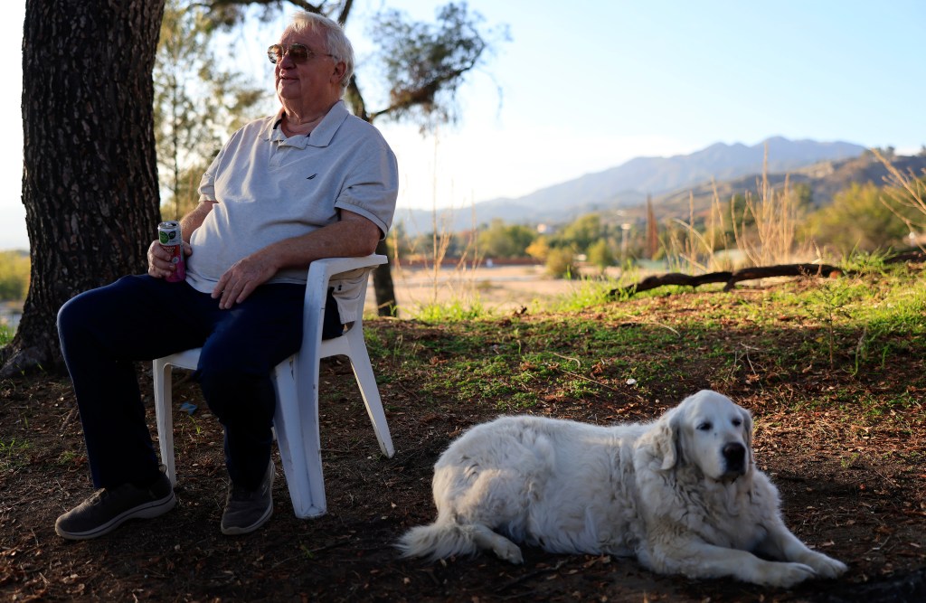 Eaton Fire survivor Ted Koerner with his golden retriever Daisy May outside his new home.