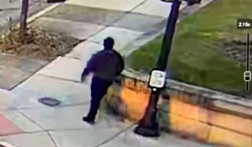 CCTV footage of the Brown University shooting suspect walking along a road near campus.