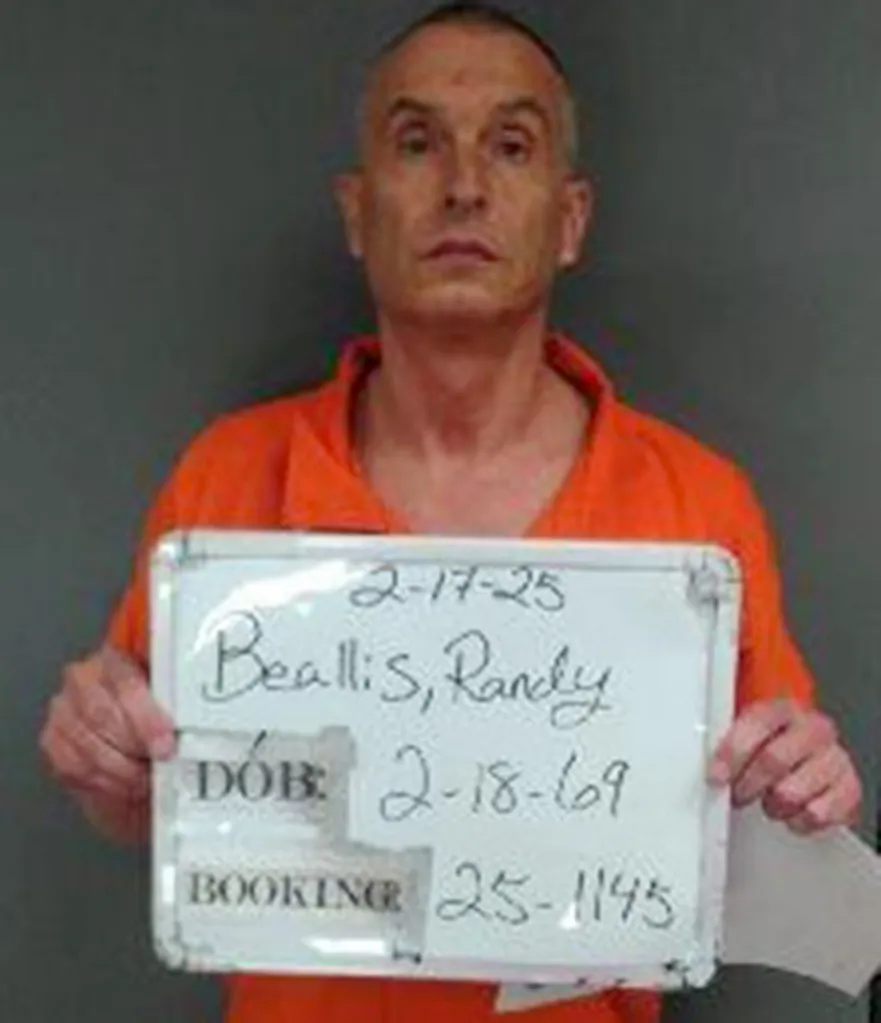 Mugshot of Randy Beallis wearing an orange uniform, holding a board with the booking date 2-17-25, his name, date of birth 2-18-69, and booking number 25-1145.