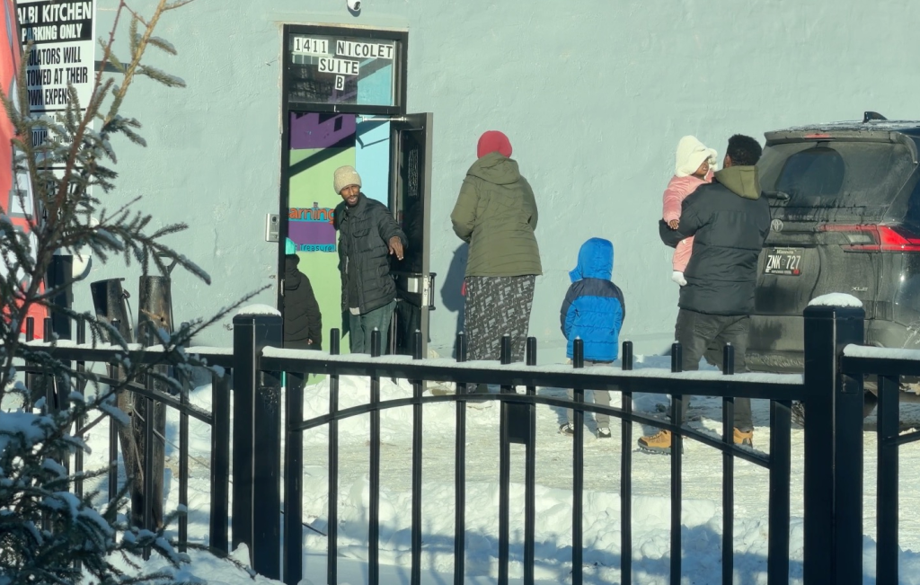 Adults and children arriving at the