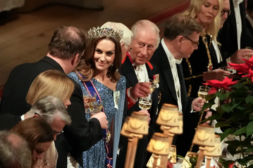 King Charles III, Germany's President Frank-Walter Steinmeier, and Britain's Catherine, Princess of Wales toast their glasses after the King delivered a speech.
