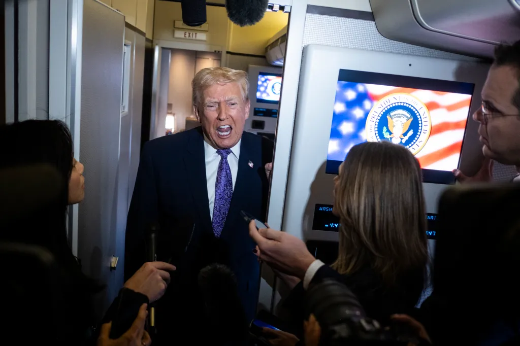 President Donald Trump speaks to the press aboard Air Force One en-route to Washington, DC on November 30, 2025.