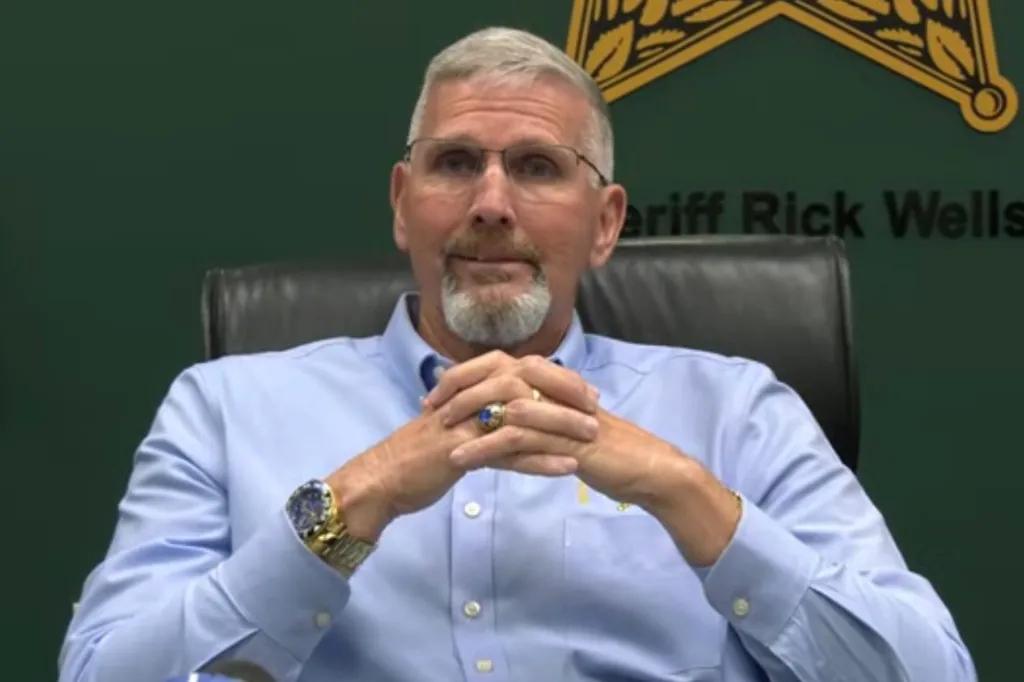 Sheriff Rick Wells speaking at a news conference.