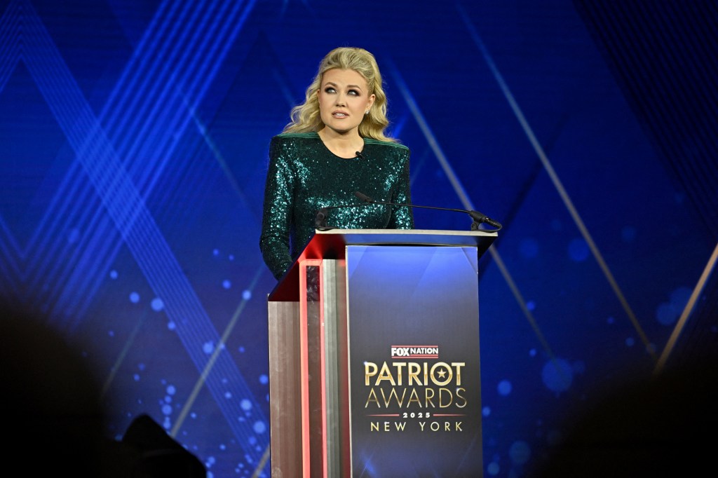 Erika Kirk accepting the Charlie Kirk Legacy Award at the 2025 Fox Nation Patriot Awards.