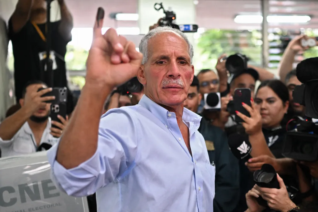 Honduras presidential candidate of the National Party Nasry Asfura shows his inked finger after casting his vote in Tegucigalpa on Nov. 30, 2025.