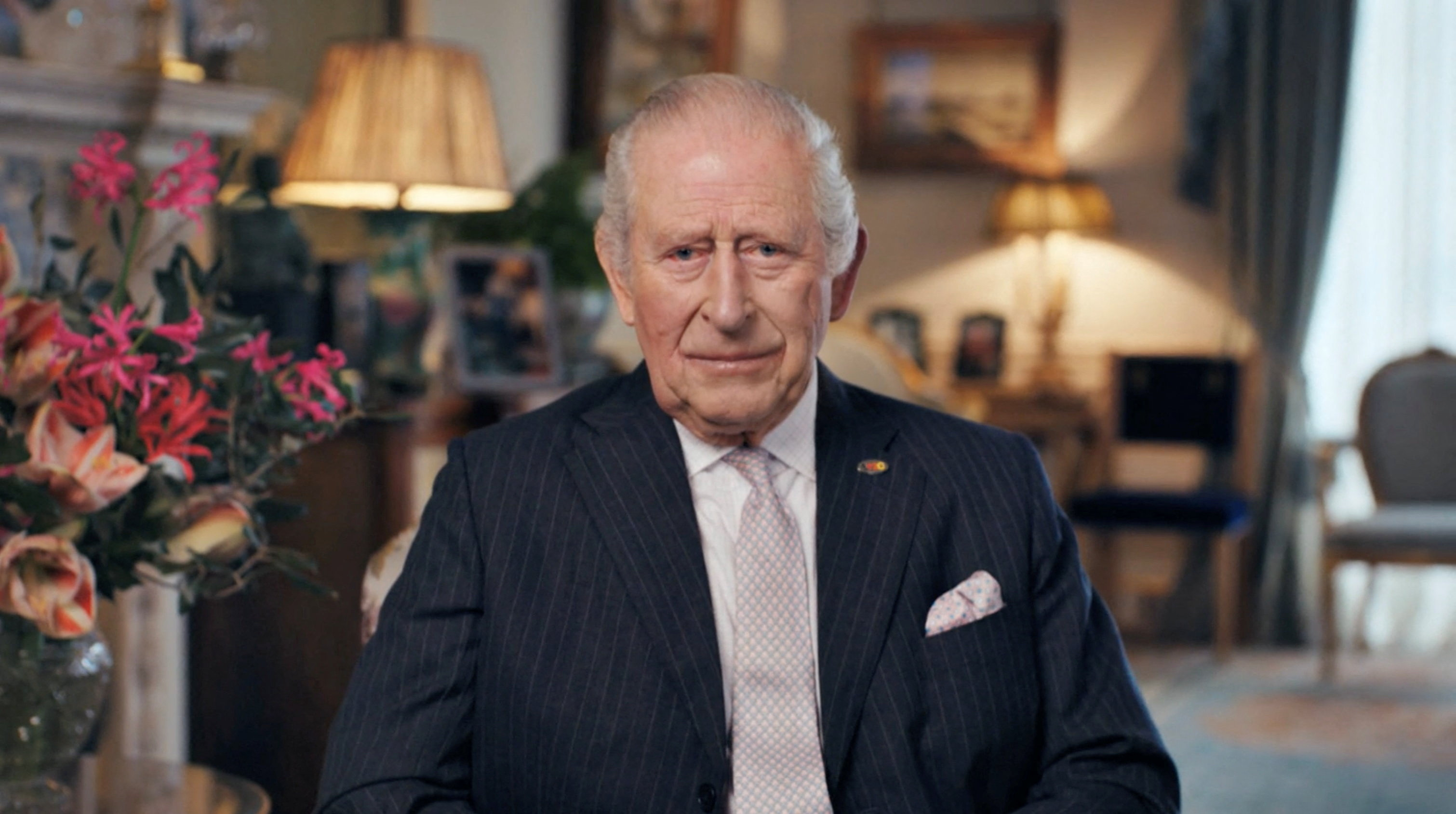 King Charles III speaking about his cancer recovery in London.