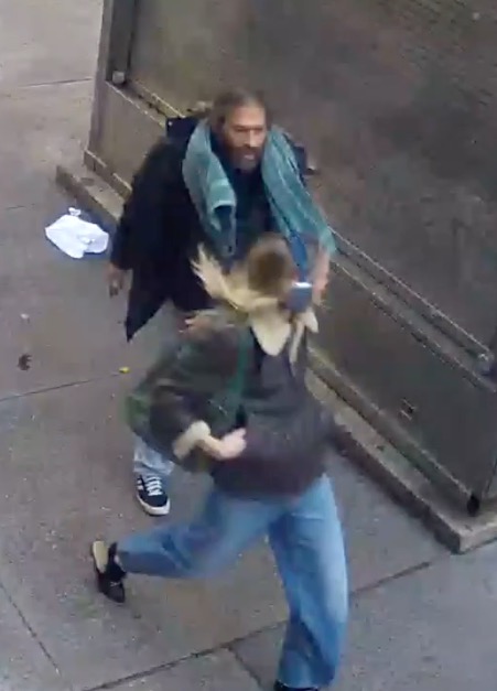 NYU student Amelia Lewis being attacked by an unidentified man on Broadway in New York.