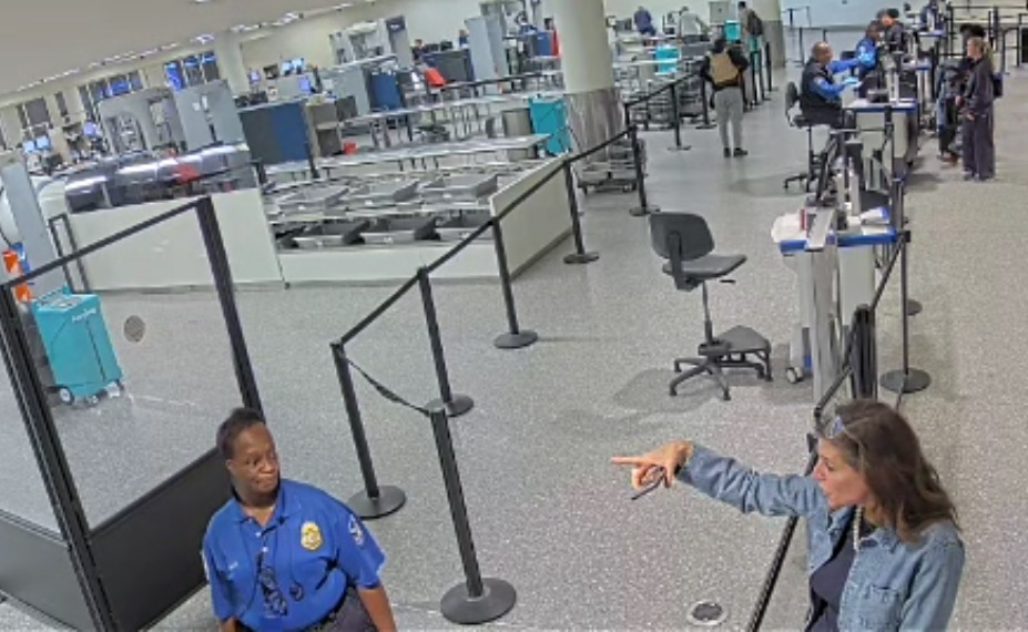 Rep. Nancy Mace pointing and appearing to berate a Charleston International Airport security officer.