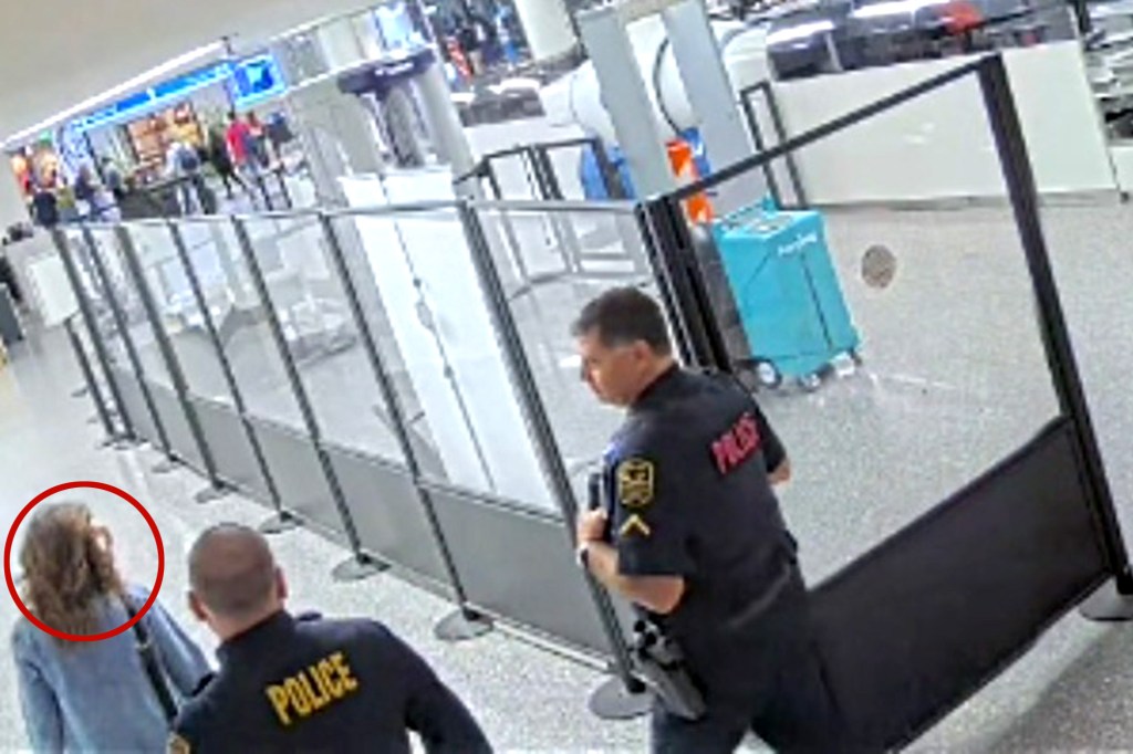 Rep. Nancy Mace at the Charleston International Airport with two police officers.