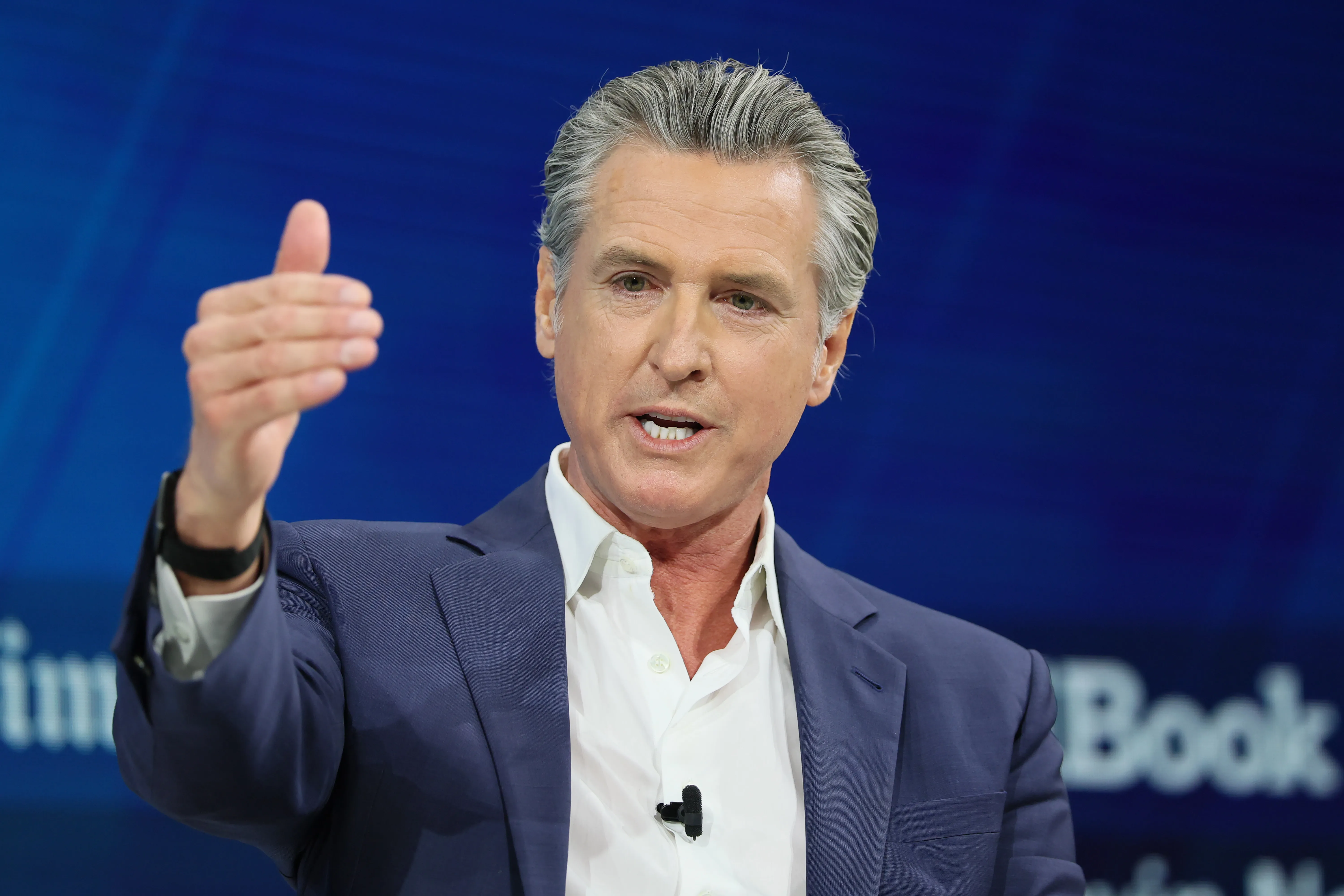 Gavin Newsom speaking at the New York Times Dealbook Summit.