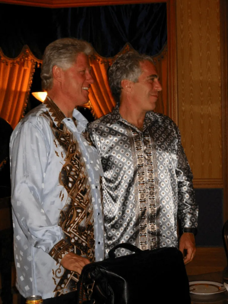 Former U.S. President Bill Clinton stands with Jeffrey Epstein in this image released by the Department of Justice in Washington, D.C., U.S., on December 19, 2025