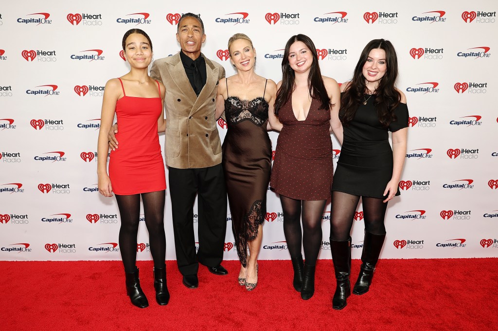 T. J. Holmes, Amy Robach, Ava McIntosh, Annie McIntosh, and Sabine Holmes pose on the red carpet at iHeartRadio Z100's Jingle Ball.