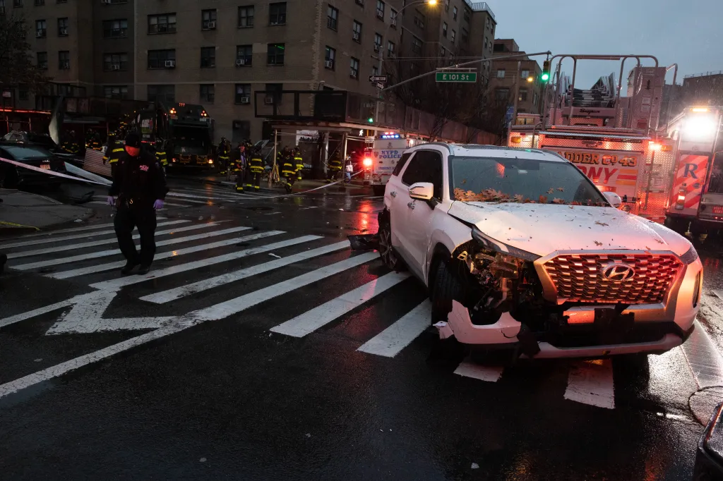 Crashed white SUV at the scene of a private garbage truck crash into several cars and a scaffold at 101 St. and 1st Ave. in Manhattan.