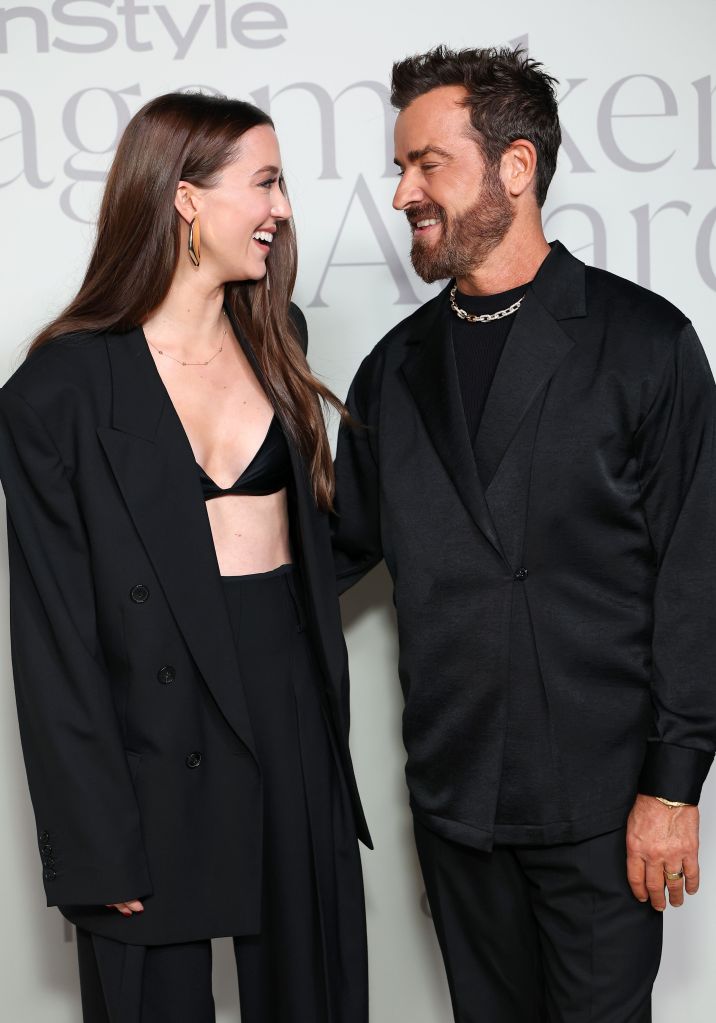 Nicole Brydon Bloom and Justin Theroux smiling at each other at the InStyle Imagemaker Awards 2025.