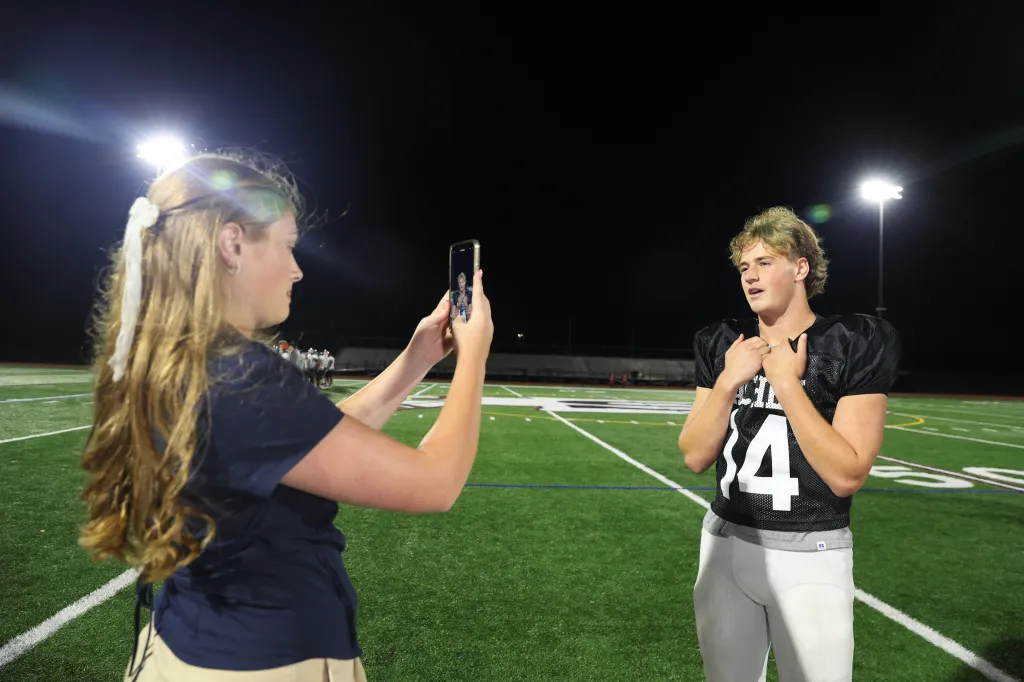 Alyssa Tappin interviews Luke Larocca for social on the sideline.