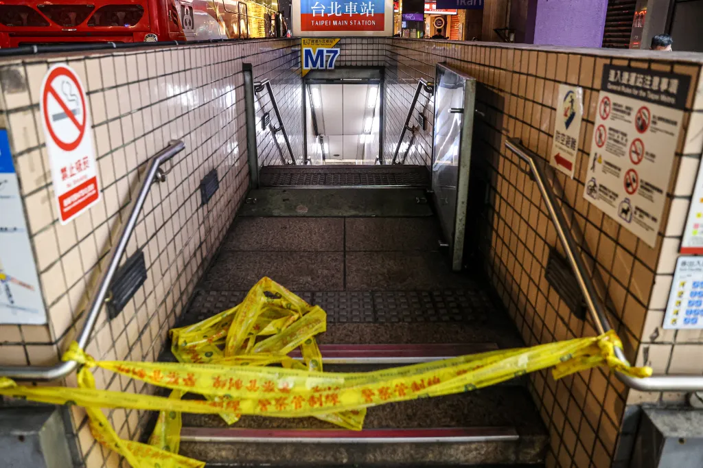 Yellow police tape blocks the M7 entrance to Taipei Main Station, following an attack.
