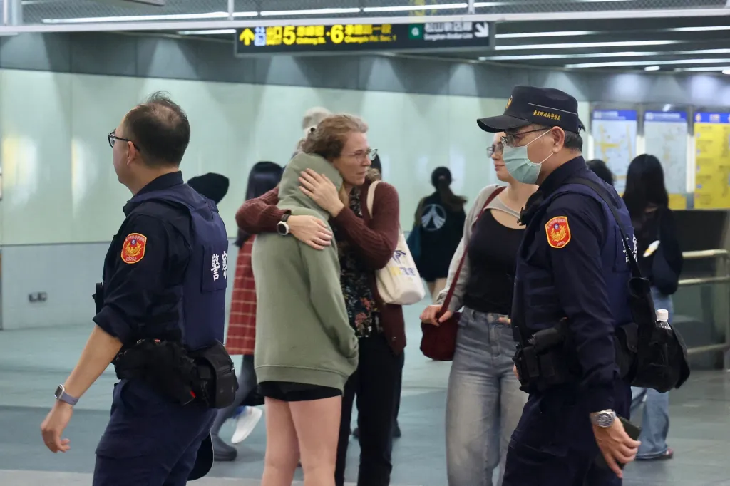 Police patrol a metro station in Taipei after attacks.