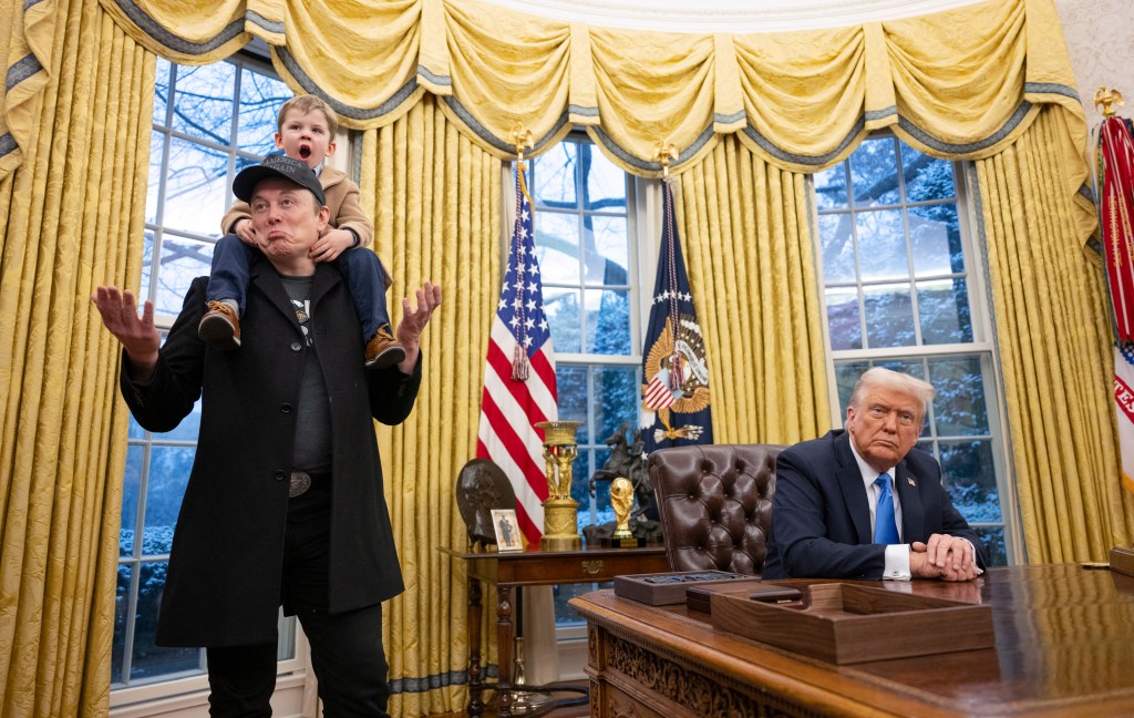 Tesla and SpaceX CEO Elon Musk with his son X Æ A-Xii join US President Donald Trump as he signs executive orders in the Oval Office of the White House in Washington, DC, February 11, 2025.. Tech billionaire Elon Musk, who has been tapped by President Donald Trump to lead federal cost-cutting efforts, said the United States would go 