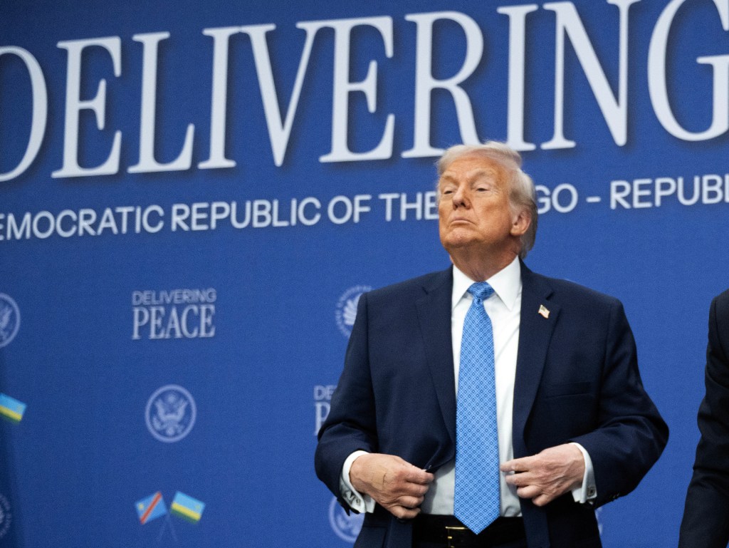 US President Donald Trump gestures after a signing ceremony with Rwandan and Democratic Republic of Congo leaders.