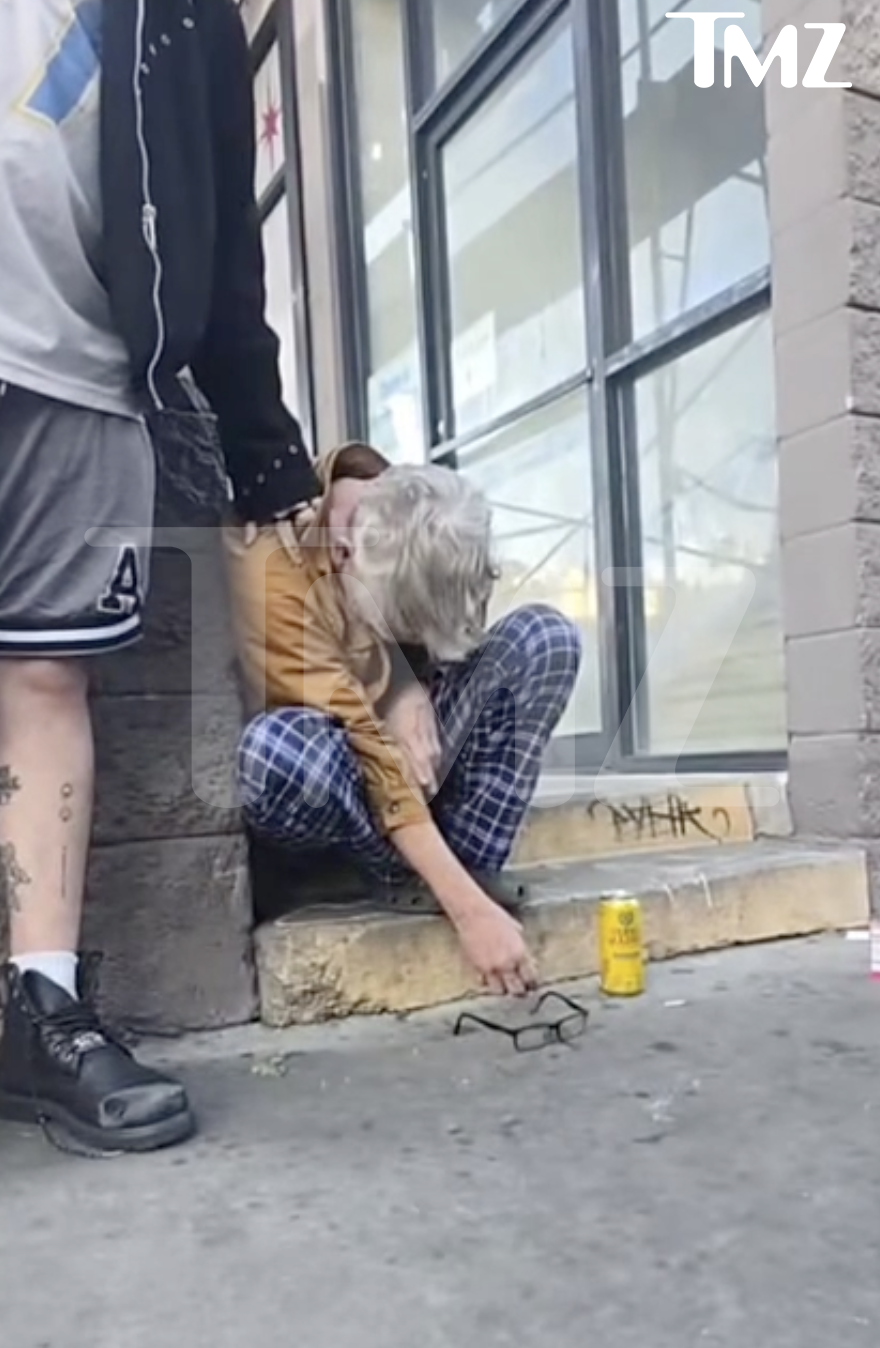 Comedian Andy Dick slumped over on a Hollywood street.