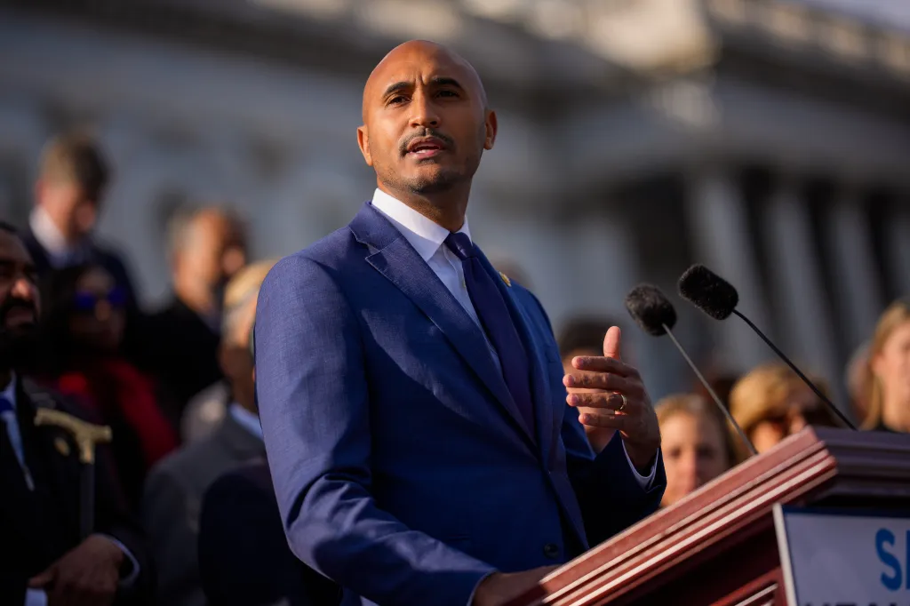 Rep. Shomari Figures speaking on the House steps.
