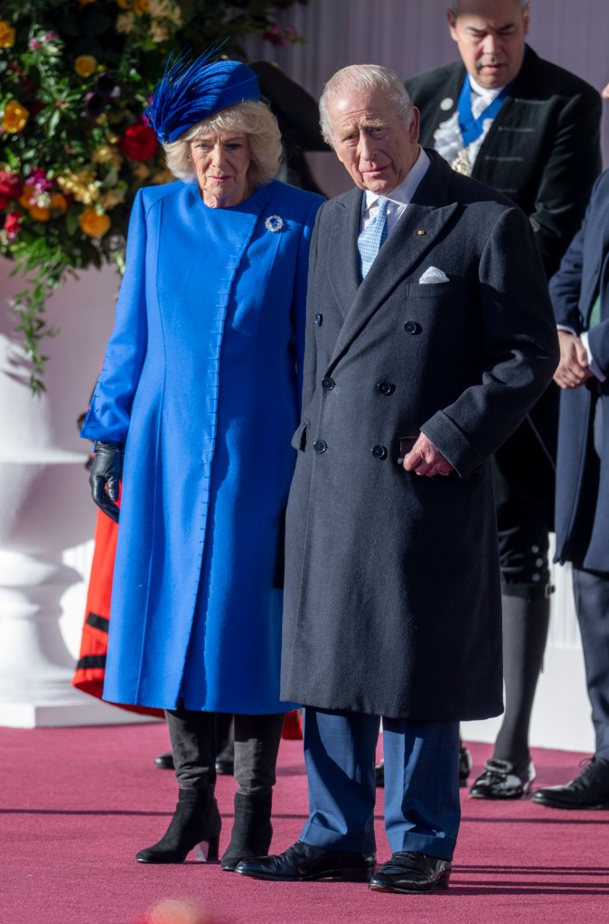 King Charles III and Queen Camilla attending a formal welcome of Germany's president at the Royal Dais.