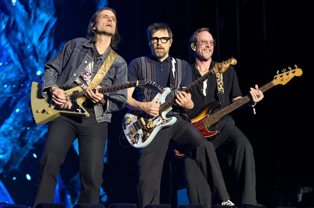 Weezer members Brian Bell, Rivers Cuomo and Scott Shriner perform during the When We Were Young festival in Las Vegas on Oct. 18, 2025.