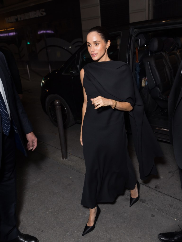 Meghan Markle, Duchess of Sussex, in a black dress arriving at the Balenciaga Womenswear Spring/Summer 2026 show at Paris Fashion Week.