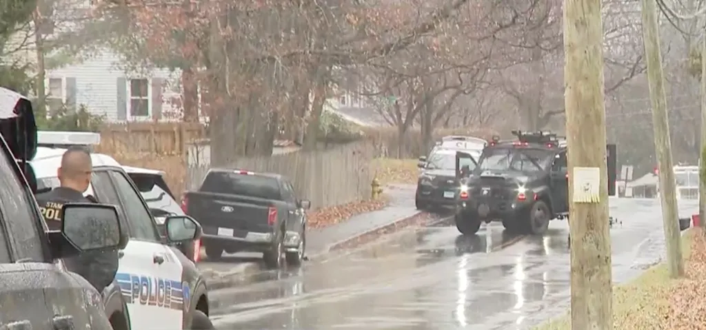 Police on Oaklawn Avenue in Stamford, with an armored vehicle present.