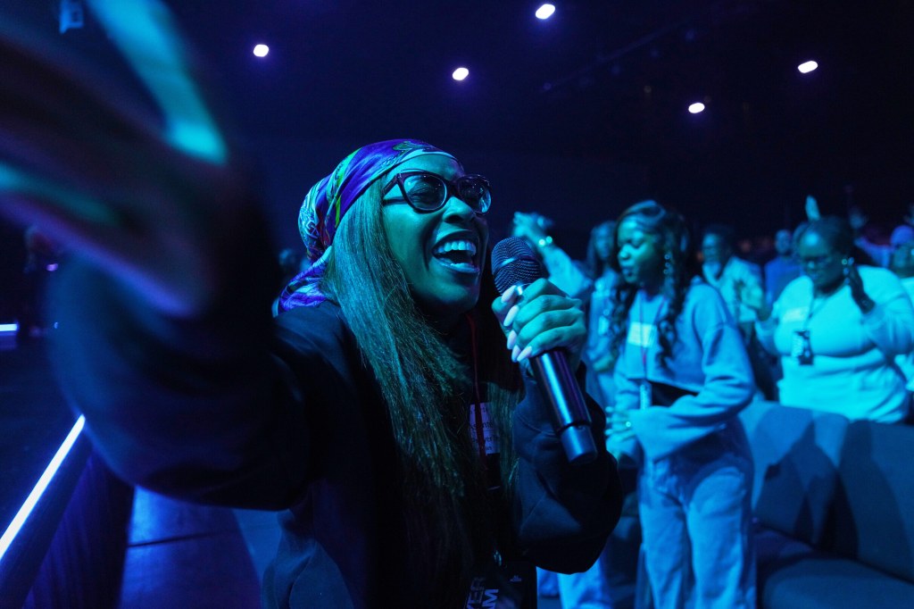 A member of the 2819 prayer team leading churchgoers in prayer.