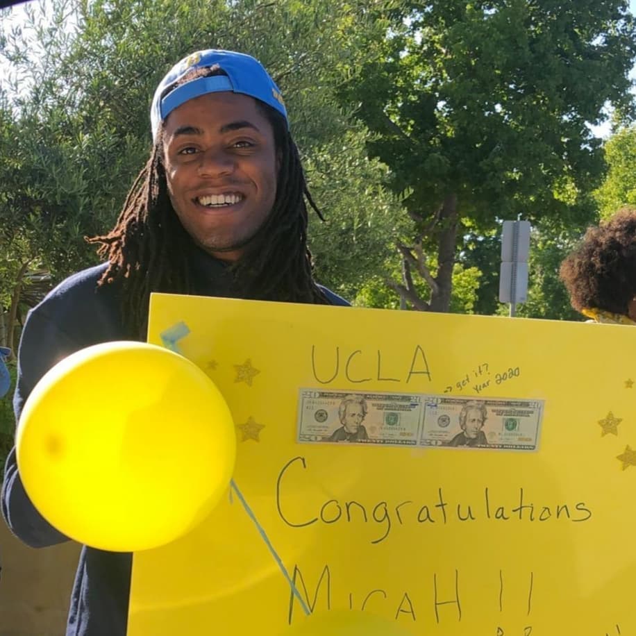 Micah, son of Jubilant Sykes, holding a