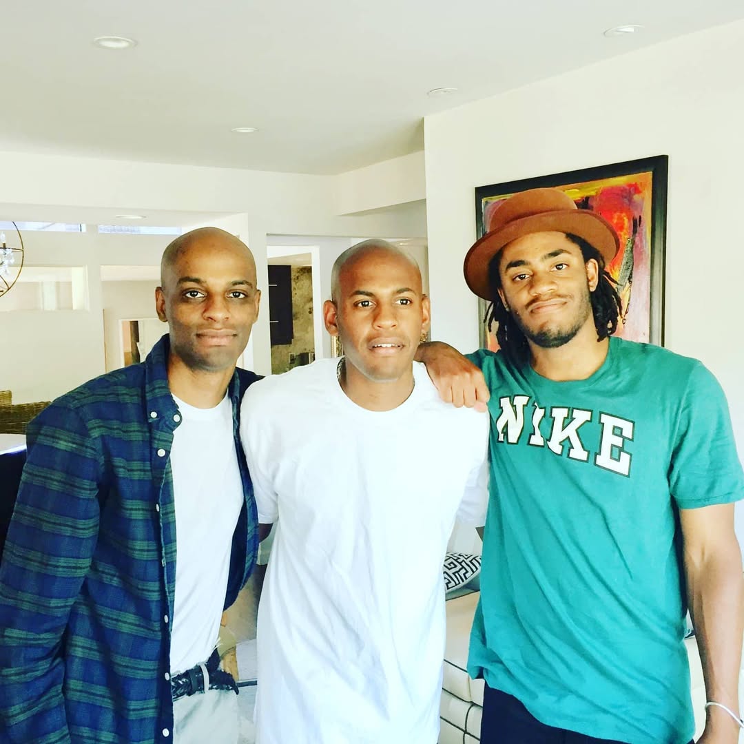 Jubilant Sykes with his sons, Micah on the right.