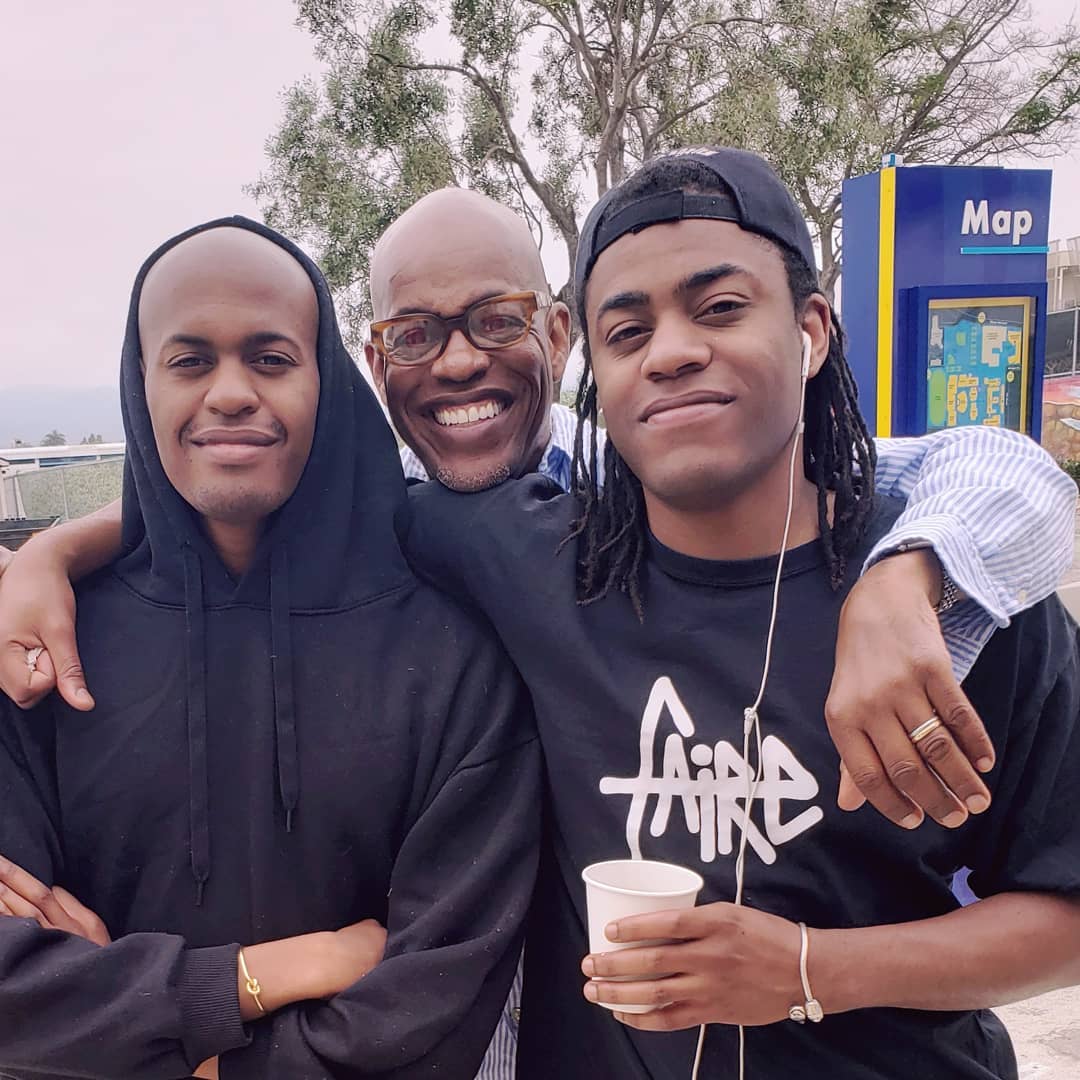 Jubilant Sykes with his sons Micah, left, and another son, right.