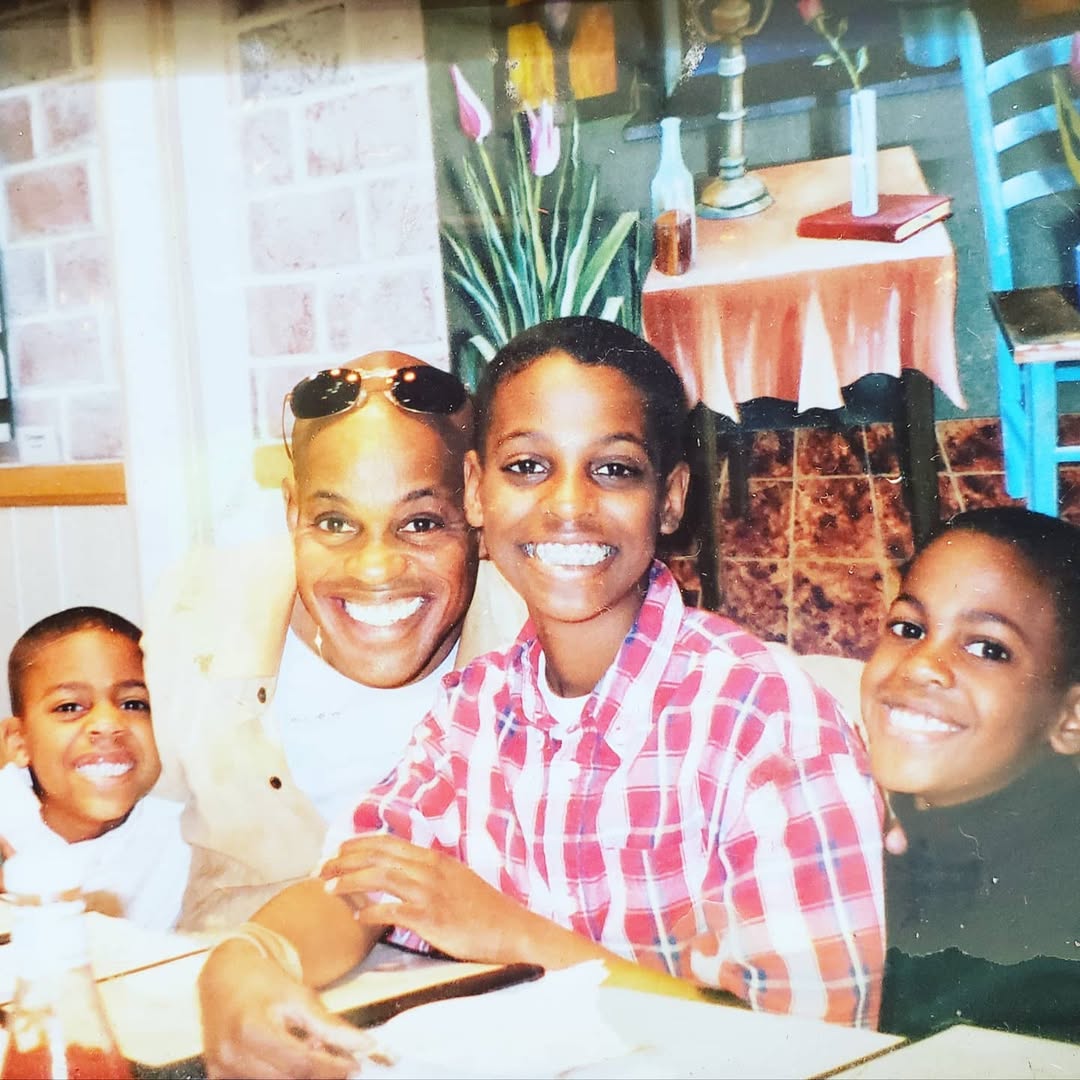 Jubilant Sykes with his sons Micah, Madison and Morgan.