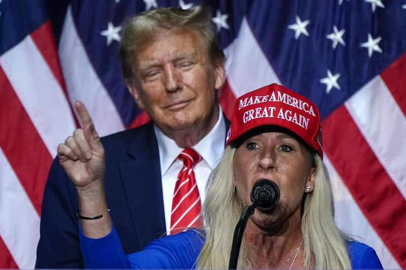 Marjorie Taylor Greene (R) speaks alongside Donald Trump at a campaign event in Rome, Georgia, on March 9, 2024.
